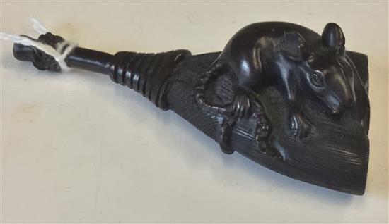 Carved hardwood netsuke, rat on a broom